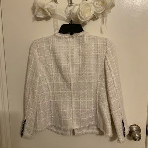 White textured blazer with silver button detail.